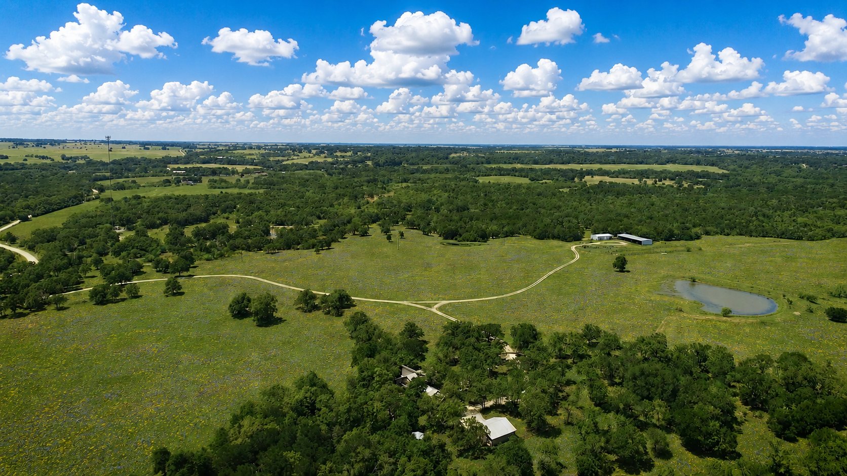 Aerial — ranch headquarters with wildflowers