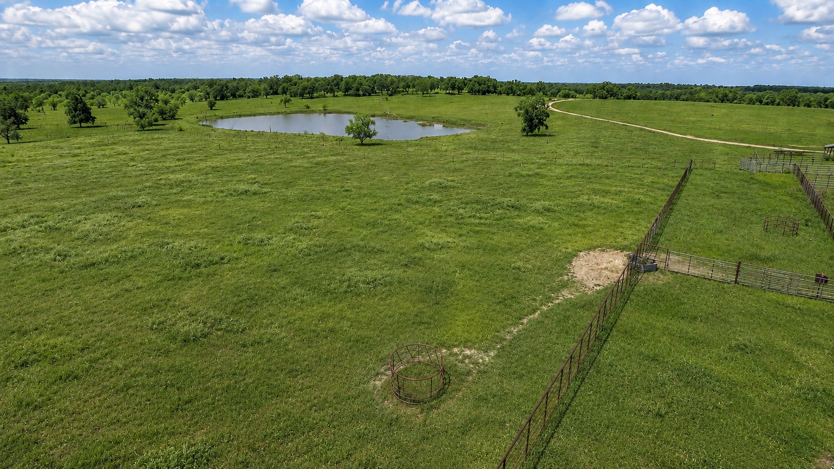 Aerial — stock tank and pasture